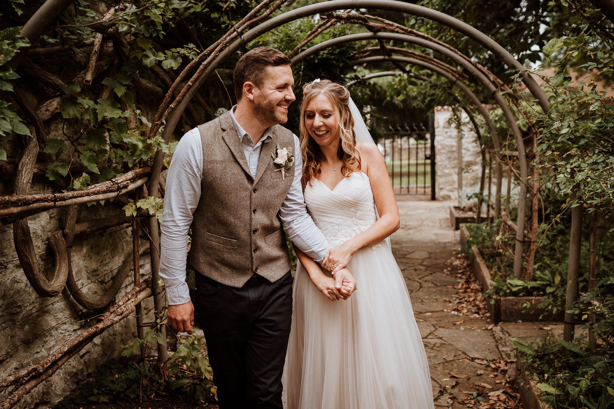 relaxed bride and groom laughing together